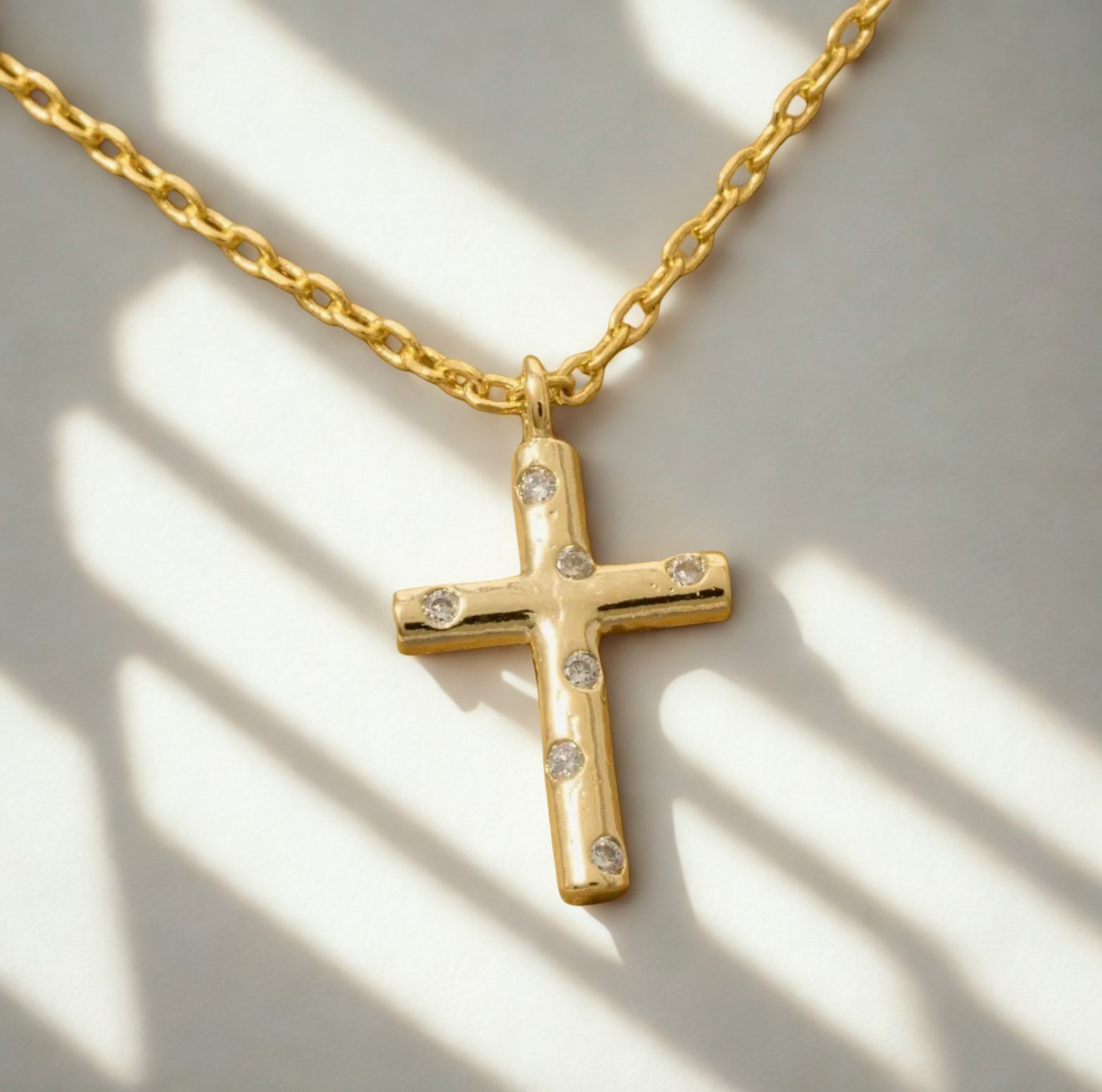 Studded cross pendant